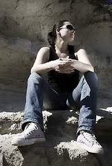Image showing Model sitting on the rocks. Urban style