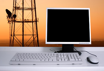 Image showing PC with sunset sky and electric pylons background