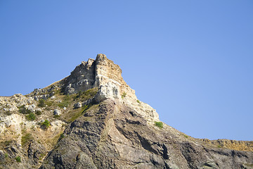 Image showing Mountain on a rocky coastline.View from sea.