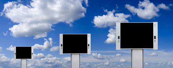 Image showing Blank advertising billboards with blue sky background