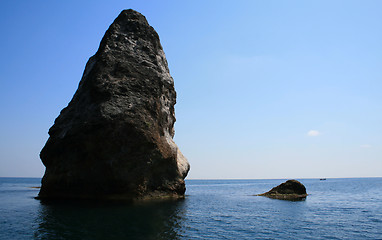 Image showing Rocks and endless sea with clear blue sky