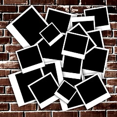 Image showing Empty instant photos on grunge brick wall background