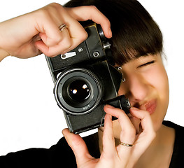 Image showing Young beautiful smiling woman holding a photo camera