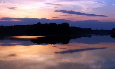 Image showing Romantic sunset on the lake with fog