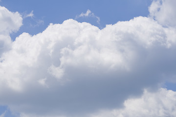 Image showing Puffy clouds on blue sky