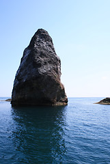 Image showing Rocks and endless sea with clear blue sky