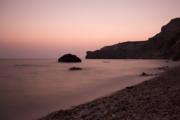 Image showing Sunset sea rocky beach