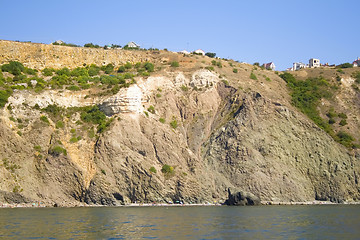 Image showing Mountain on a rocky coastline.View from sea.