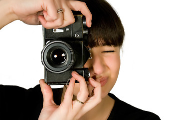 Image showing Young beautiful smiling woman holding a photo camera