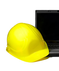 Image showing Yellow Hard Hat on a laptop.Industrial concept