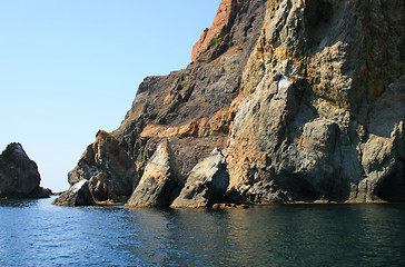 Image showing Mountain on a rocky coastline.View from sea.