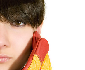 Image showing Girl in yellow hard hat and red gloves