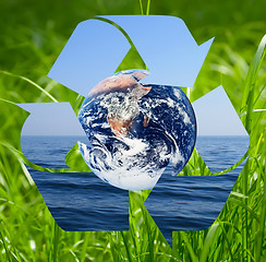 Image showing Recycle symbol made from sea and grass photo