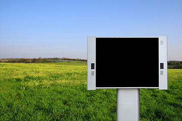 Image showing Blank advertising billboard with spring field background