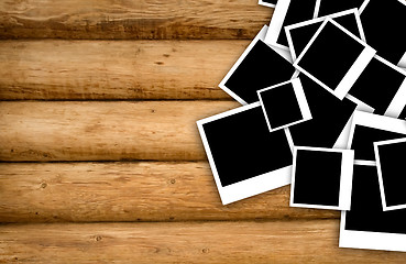 Image showing Empty instant photos on grunge wood background