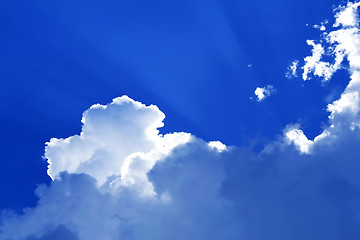 Image showing Sunny clouds with rays of light