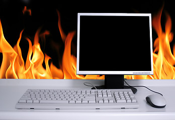 Image showing PC with black desktop and fire flames background