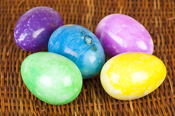 Image showing Easter eggs in different colors on the braided surface