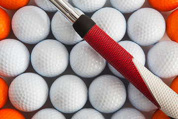 Image showing Golf putter and balls