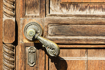 Image showing Texture of old wooden door with a metal handle
