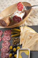 Image showing cold cut platter with pita bread and pickles