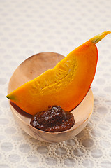 Image showing fresh pumpkin slice on wood bowl