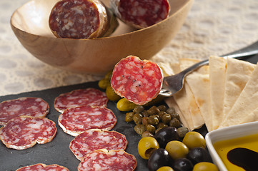 Image showing cold cut platter with pita bread and pickles