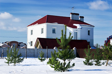 Image showing White house behind a brick wall