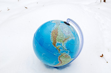 Image showing earth globe sphere winter snow snowbank concept 