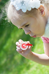 Image showing Girl blow bubbles
