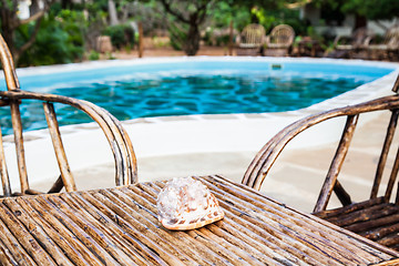 Image showing Chairs on swimming pool border