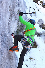 Image showing man climbing an ice wall