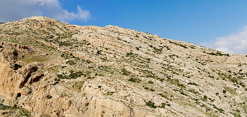 Image showing Texture of a layered sedimentary rock under the blue sky