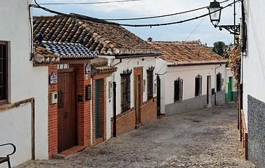 Image showing Small curved street in Granada, Spain