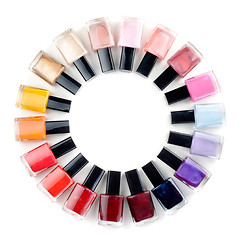 Image showing Coloured nail polish bottles stacked circle