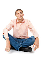 Image showing Smiling man sitting in the lotus position