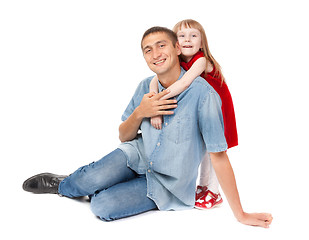 Image showing Smiling father and young daughter sitting on the floor