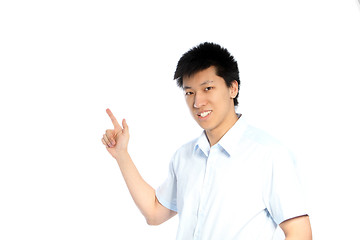 Image showing Asian man pointing to blank copyspace