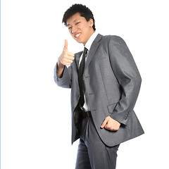 Image showing Successful Asian businessman giving thumbs up