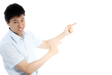 Image showing Asian man pointing with both hands