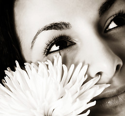 Image showing Girl with a white flower