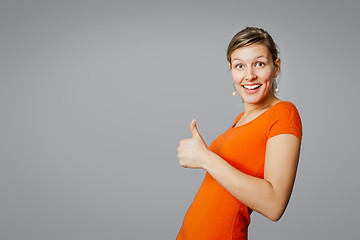 Image showing young woman thumb up