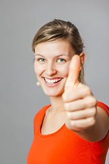 Image showing young woman thumb up