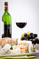 Image showing cheese plate with grapes and wine dinner