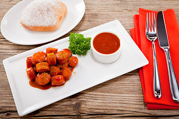 Image showing curry wurst spicy sausage with curry and ketchup