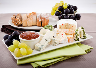 Image showing cheese plate with grapes and wine dinner