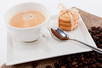 Image showing fresh aromatic coffee and cookies on table