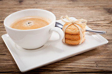 Image showing fresh aromatic coffee and cookies on table