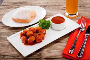 Image showing curry wurst spicy sausage with curry and ketchup