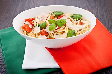 Image showing fresh tasty pasta spaghetti with tomatoes and basil